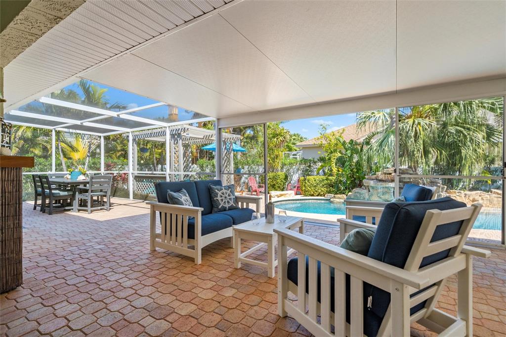 725 Monte Cristo Boulevard Tierra Verde, FL 33715 - Photo 16 of 63 a view of a dining room with furniture water view and pool table and chairs