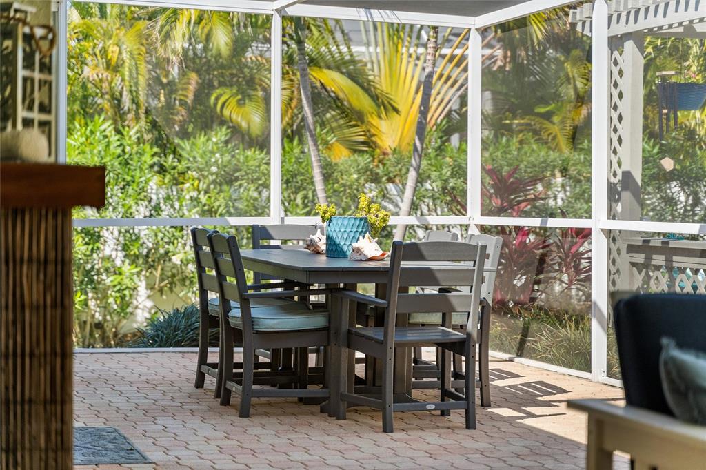 725 Monte Cristo Boulevard Tierra Verde, FL 33715 - Photo 17 of 63 a view of an outdoor sitting area with furniture and wooden floor