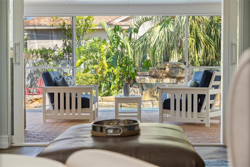 725 Monte Cristo Boulevard Tierra Verde, FL 33715 - Photo 21 of 63 a living room with furniture and a large window