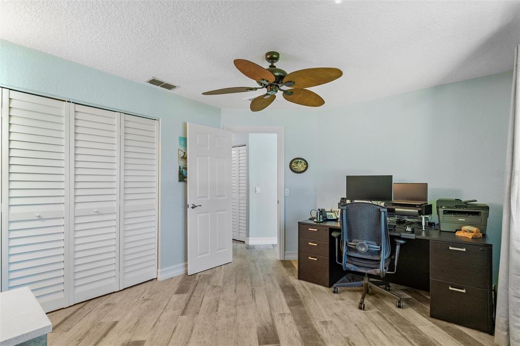 725 Monte Cristo Boulevard Tierra Verde, FL 33715 - Photo 26 of 63 a view of a workspace with furniture and a window