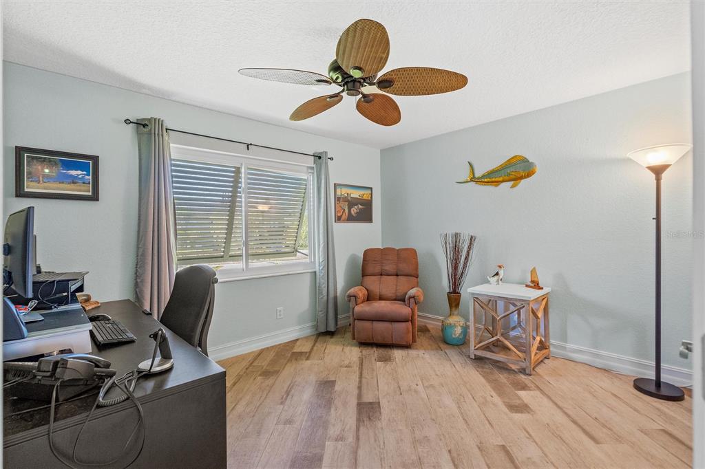 725 Monte Cristo Boulevard Tierra Verde, FL 33715 - Photo 29 of 63 a living room with furniture and a window