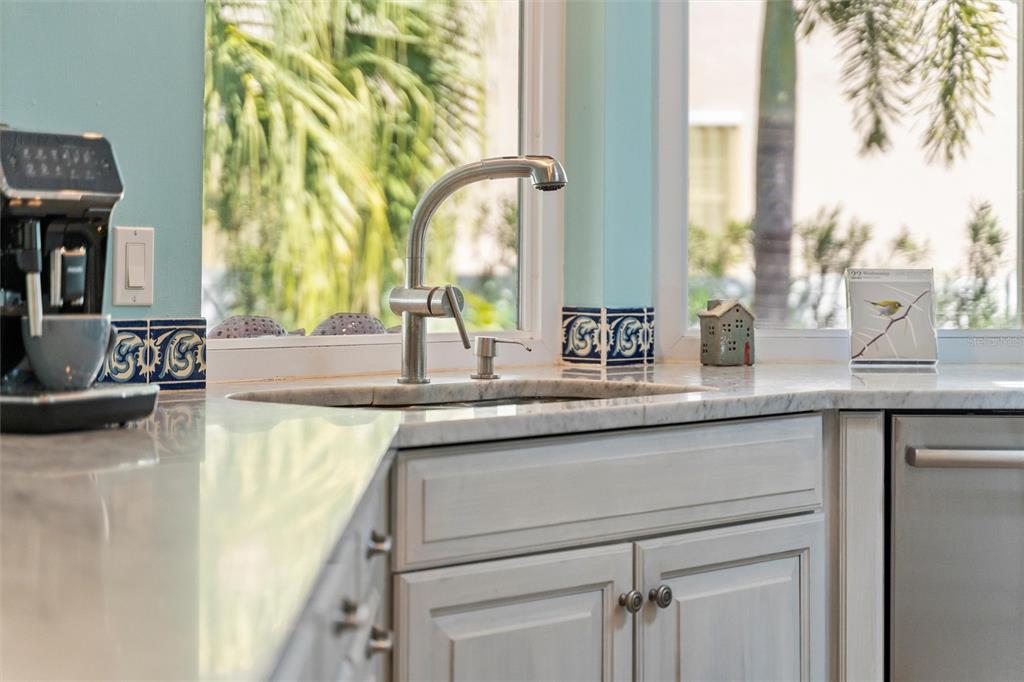 725 Monte Cristo Boulevard Tierra Verde, FL 33715 - Photo 32 of 63 a kitchen with a sink and a window