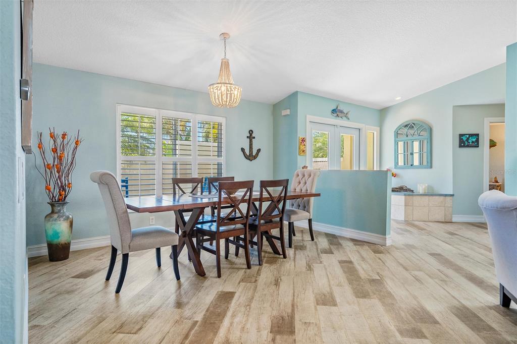 725 Monte Cristo Boulevard Tierra Verde, FL 33715 - Photo 38 of 63 a view of a dining room with furniture window and wooden floor