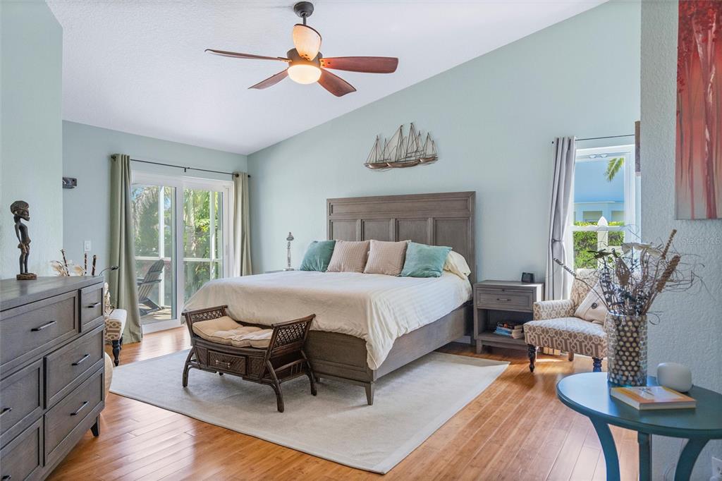 725 Monte Cristo Boulevard Tierra Verde, FL 33715 - Photo 39 of 63 a bed room with a bed and a chair