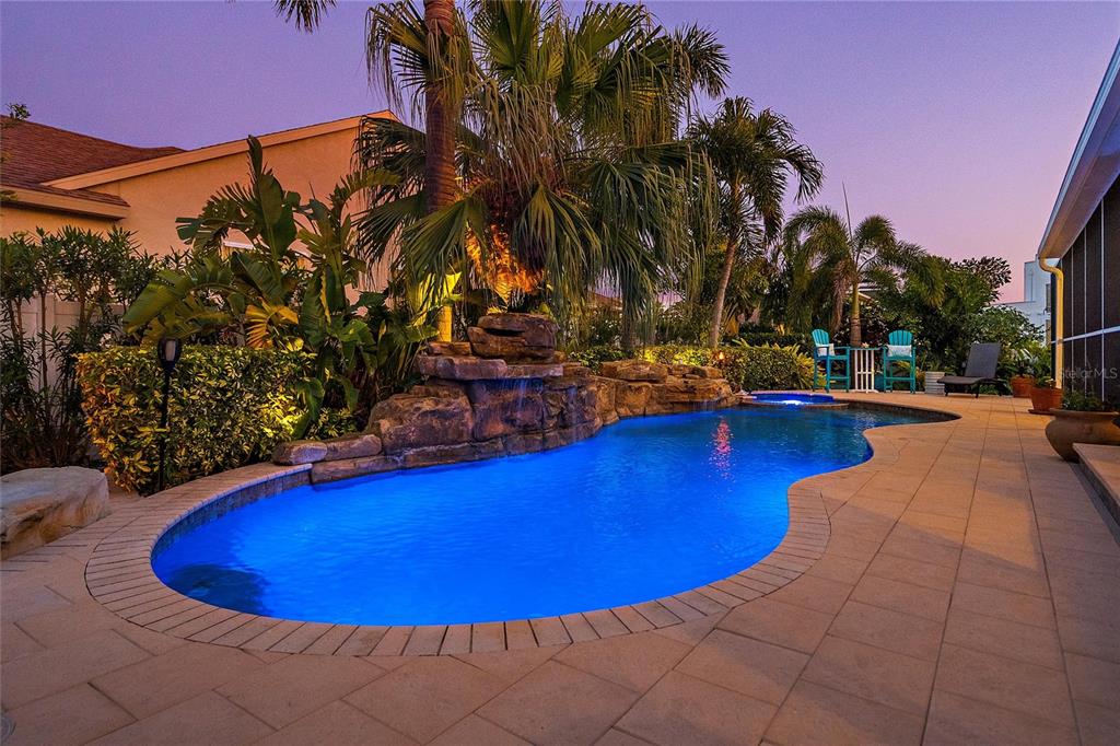 725 Monte Cristo Boulevard Tierra Verde, FL 33715 - Photo 57 of 63 a view of a swimming pool with an outdoor space and seating area