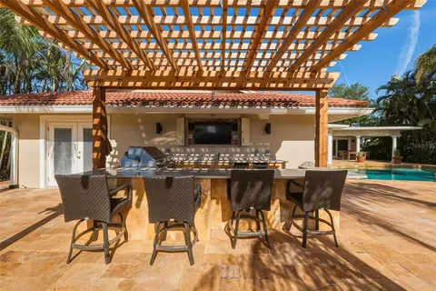 a view of a lake with a table under an umbrella