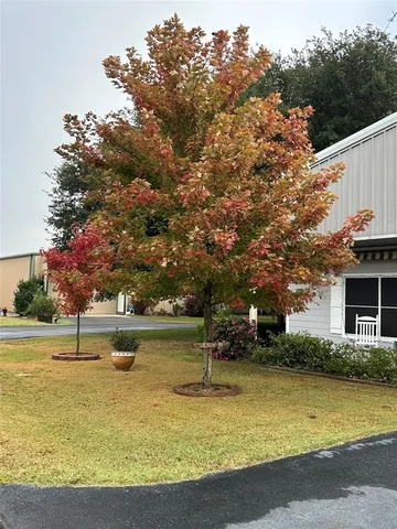 a view of a swimming pool with an outdoor space and seating area