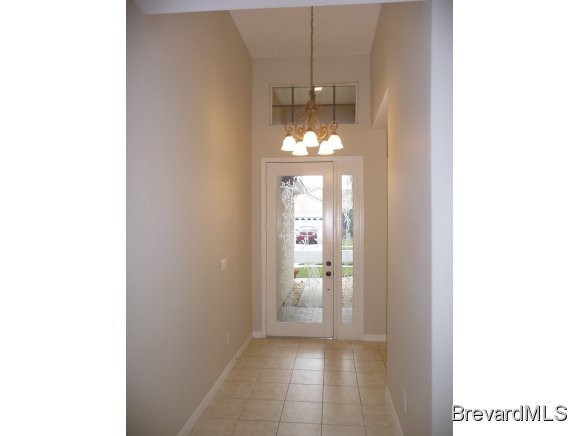 8225 Simpkins Way Melbourne, FL 32940 - Photo 2 of 12 a view of a hallway with bathroom