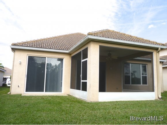 8225 Simpkins Way Melbourne, FL 32940 - Photo 11 of 12 a view of a house with a yard