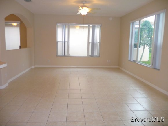 8225 Simpkins Way Melbourne, FL 32940 - Photo 4 of 12 a view of an empty room with a window