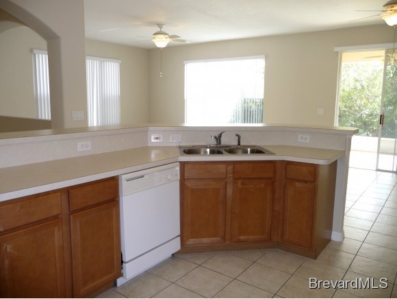 8225 Simpkins Way Melbourne, FL 32940 - Photo 7 of 12 a kitchen with a sink cabinets and window