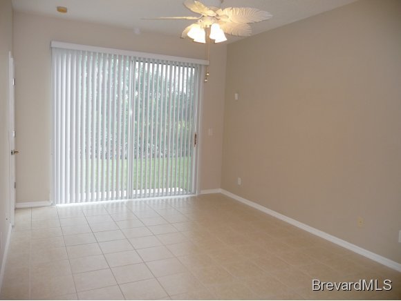 8225 Simpkins Way Melbourne, FL 32940 - Photo 8 of 12 a view of a livingroom with a chandelier fan