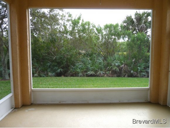 8225 Simpkins Way Melbourne, FL 32940 - Photo 10 of 12 a view of a yard with an outdoor seating