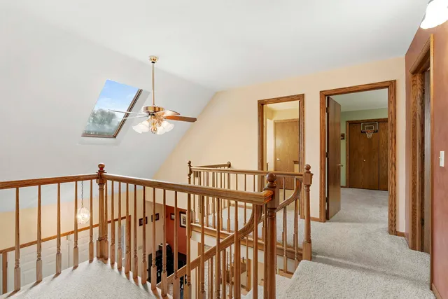 a view of hallway with wooden floor
