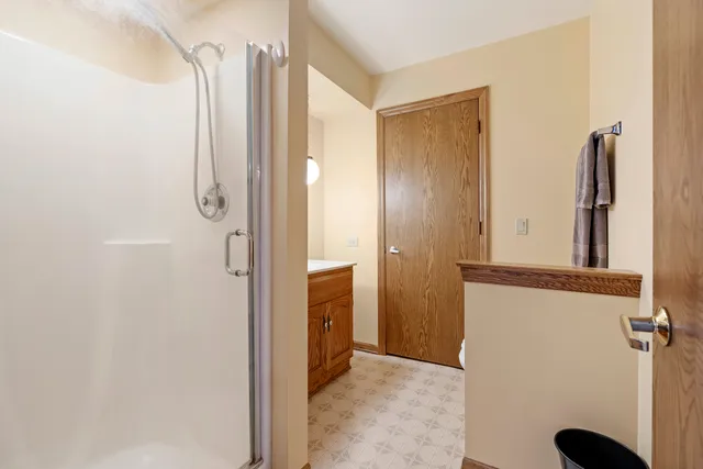 a view of a hallway with closet and door