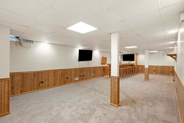 a view of a hall with wooden floor