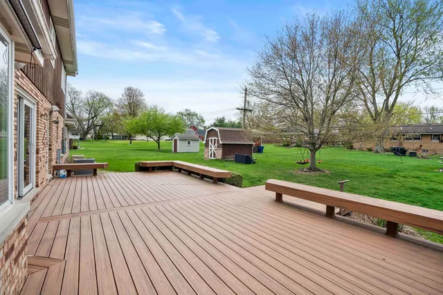 a view of outdoor space with pool and yard