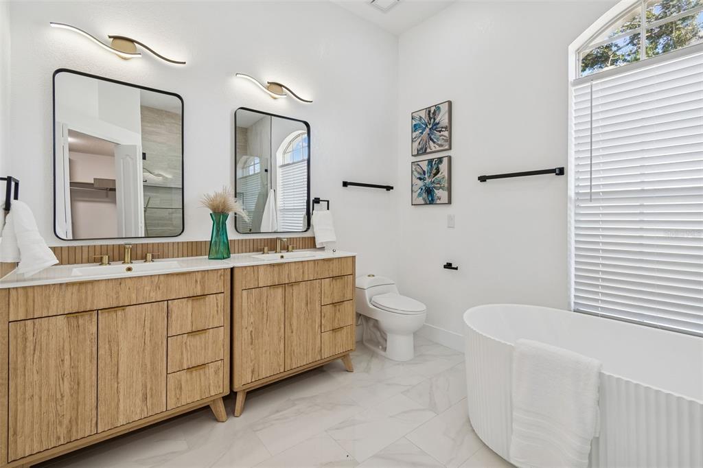8443 Ridgebrook Circle Odessa, FL 33556 - Photo 1 of 1 a bathroom with a toilet sink and mirror