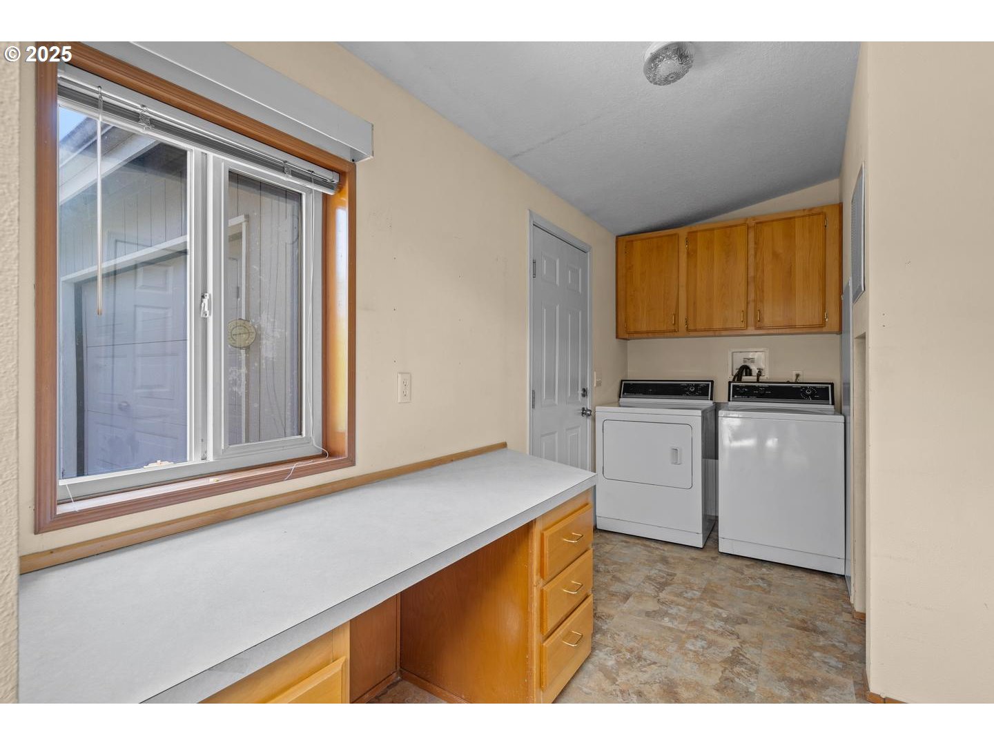 17629 Northwest Shady Fir Loop Beaverton, OR 97006 - Photo 11 of 27 a kitchen view with a stove a sink and a window