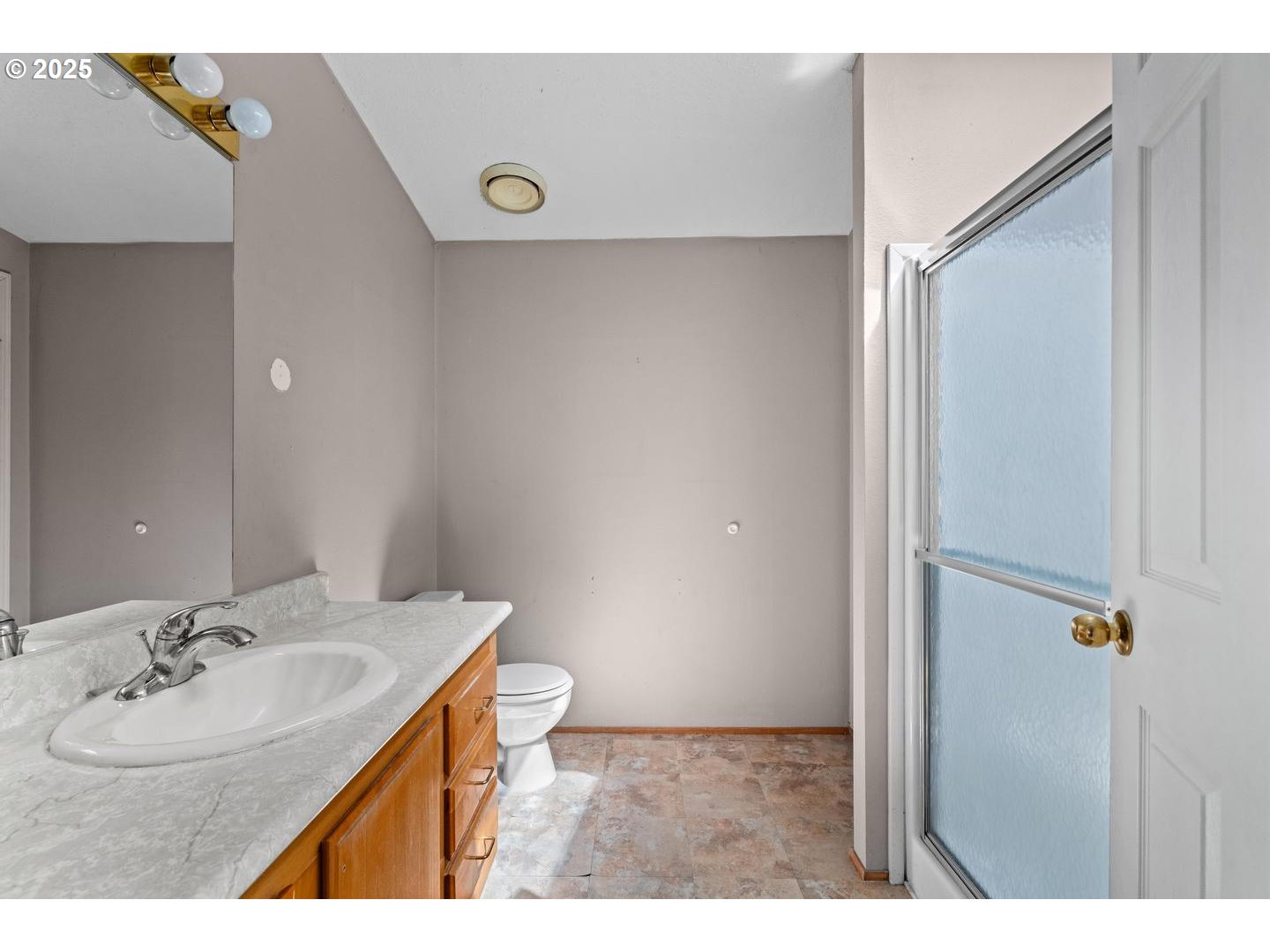 17629 Northwest Shady Fir Loop Beaverton, OR 97006 - Photo 17 of 27 a bathroom with a sink and a mirror