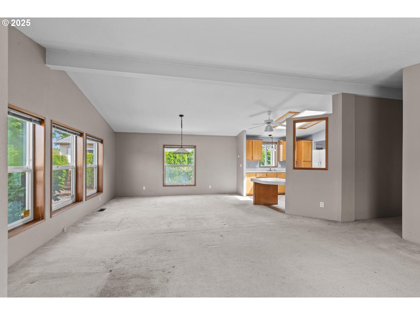 17629 Northwest Shady Fir Loop Beaverton, OR 97006 - Photo 4 of 27 a view of an empty room with a window