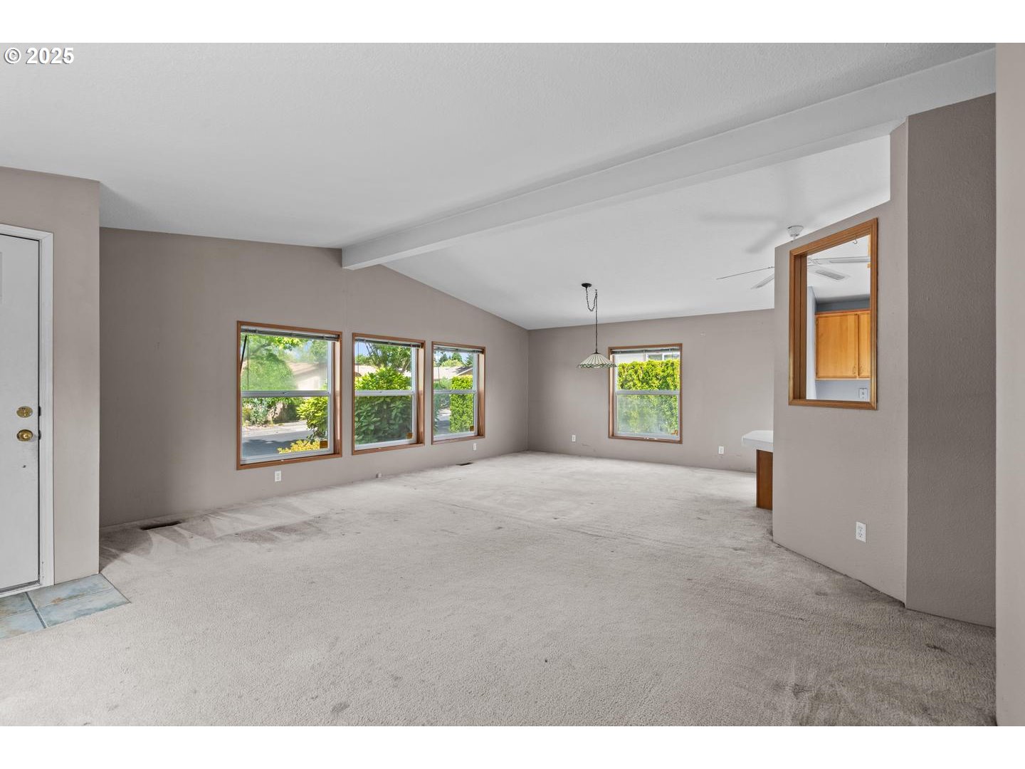 17629 Northwest Shady Fir Loop Beaverton, OR 97006 - Photo 5 of 27 a view of an empty room with a window