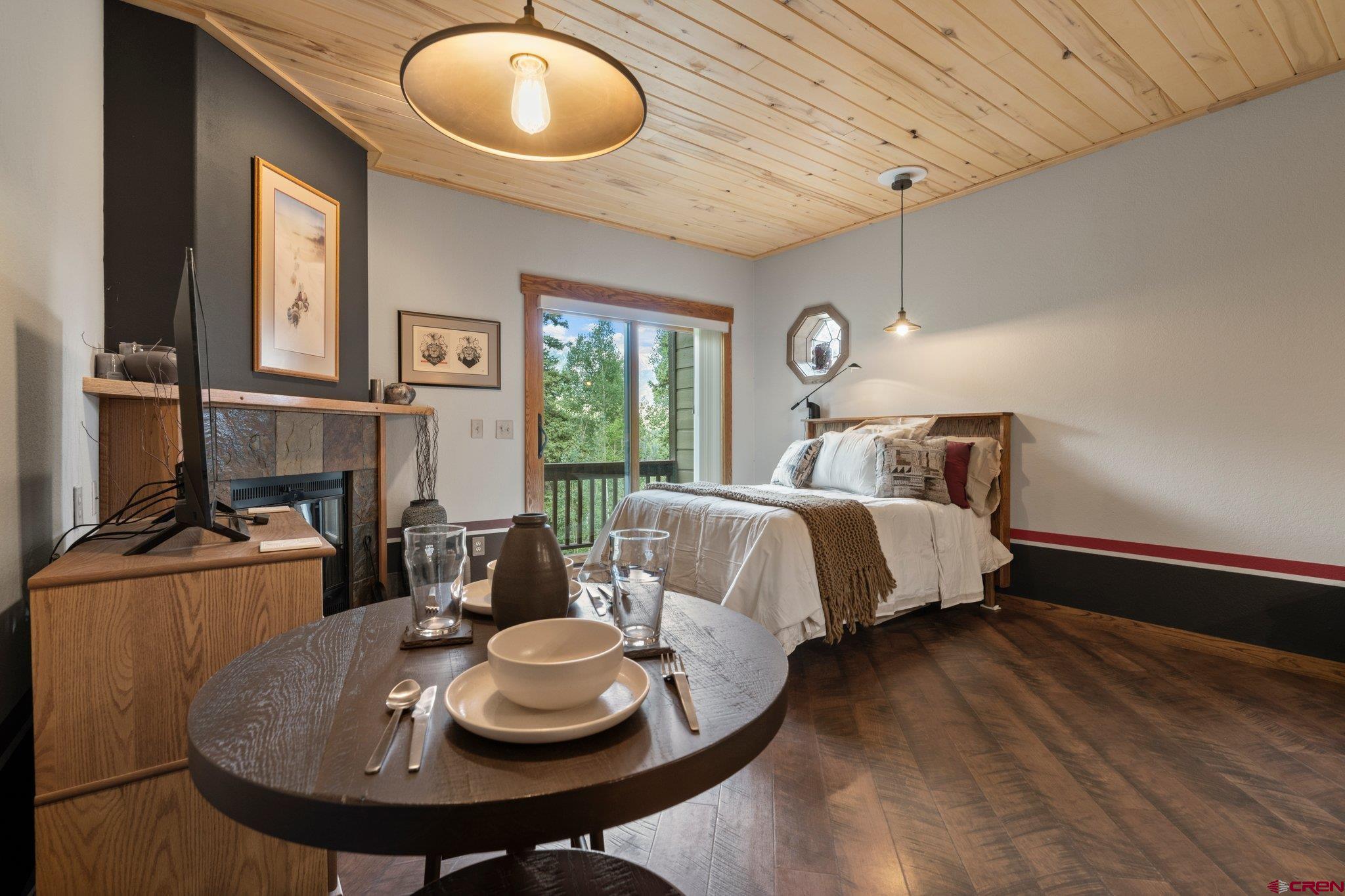 50827 Highway 550, Unit 339 Durango, CO 81301 - Photo 12 of 28 a bed room with a bed and a chandelier