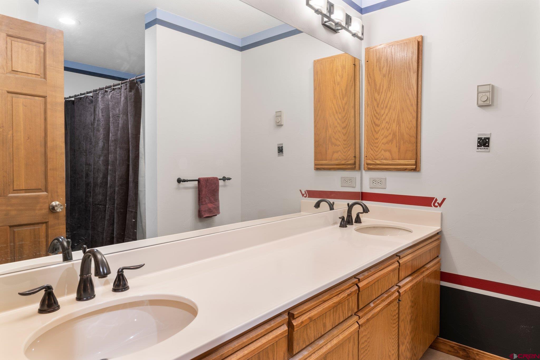 50827 Highway 550, Unit 339 Durango, CO 81301 - Photo 16 of 28 a bathroom with a sink and a mirror