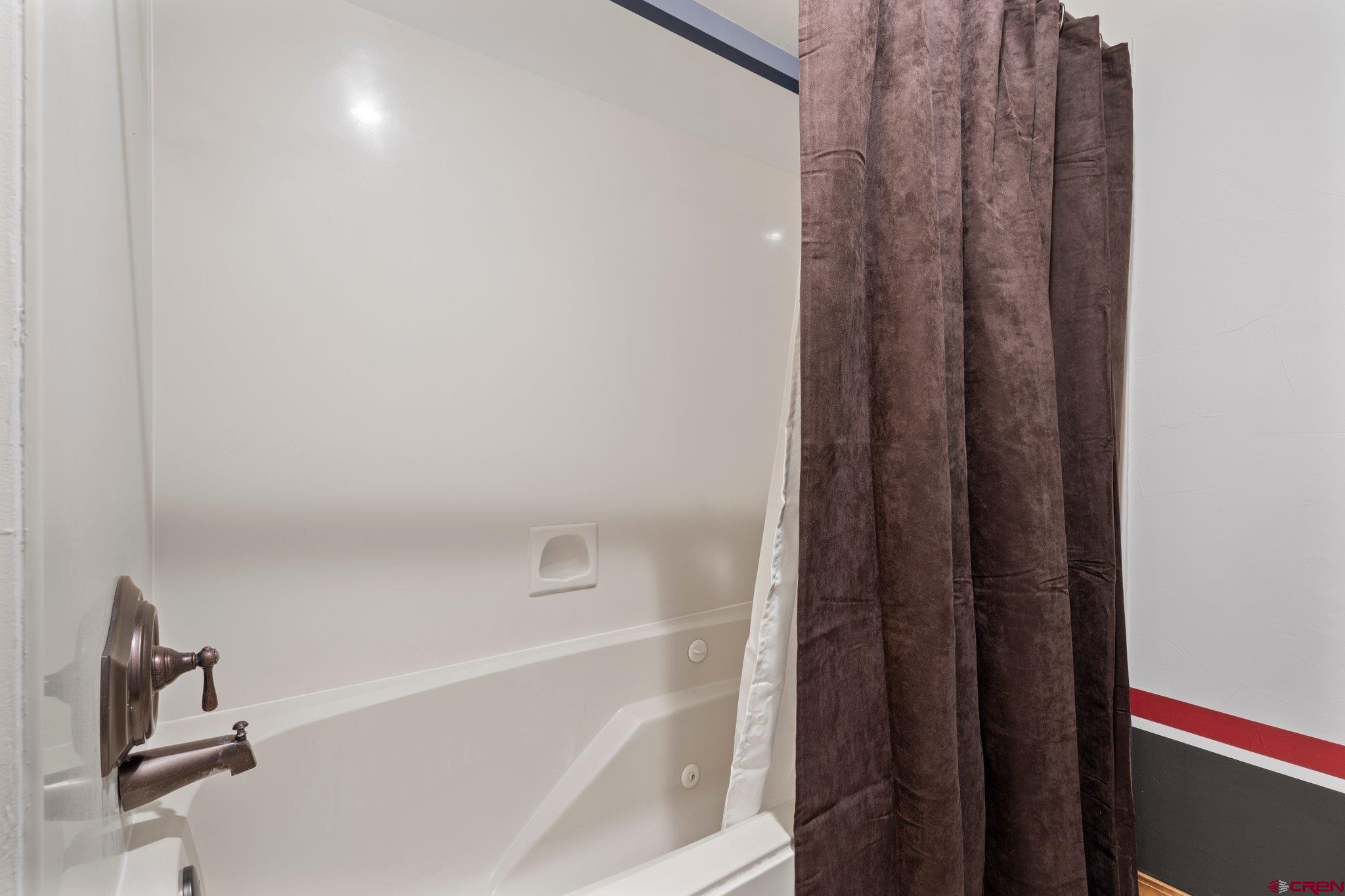 50827 Highway 550, Unit 339 Durango, CO 81301 - Photo 18 of 28 a bathroom with a bathtub