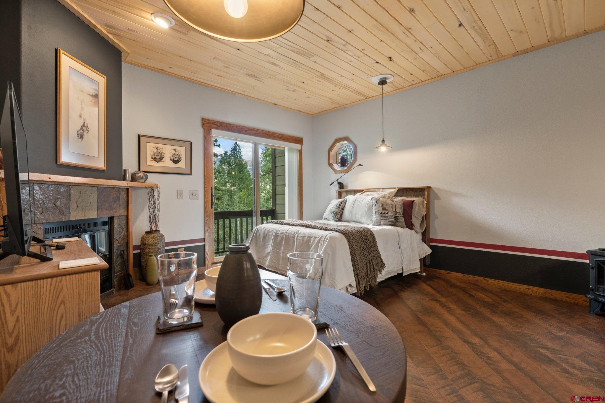 50827 Highway 550, Unit 339 Durango, CO 81301 - Photo 2 of 28 a bedroom with a bed and wooden floor