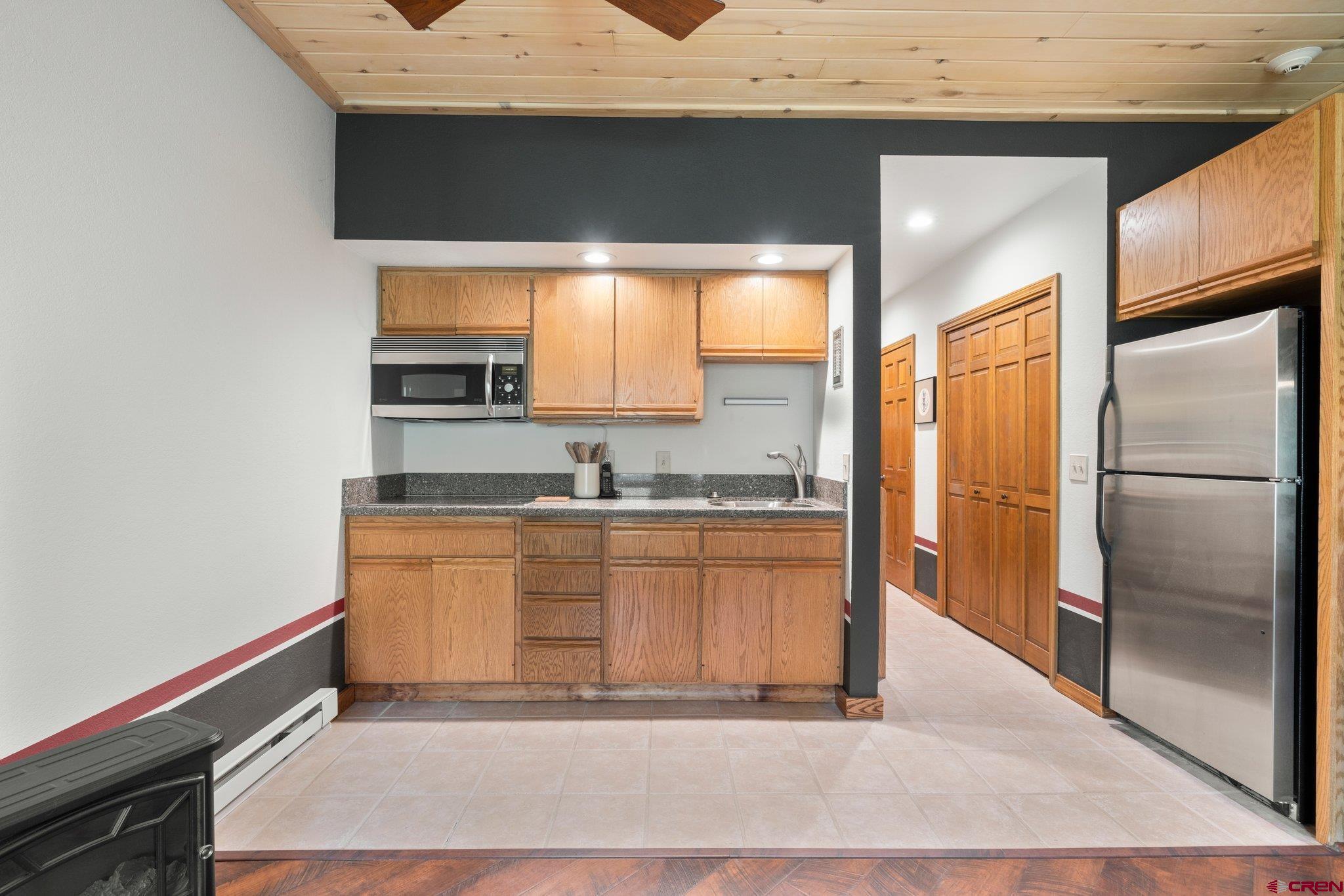 50827 Highway 550, Unit 339 Durango, CO 81301 - Photo 5 of 28 a kitchen with stainless steel appliances granite countertop a sink and a refrigerator