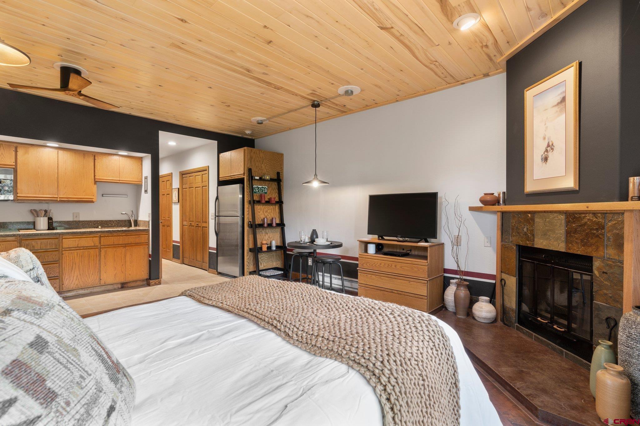 50827 Highway 550, Unit 339 Durango, CO 81301 - Photo 6 of 28 a bedroom with a bed and a television