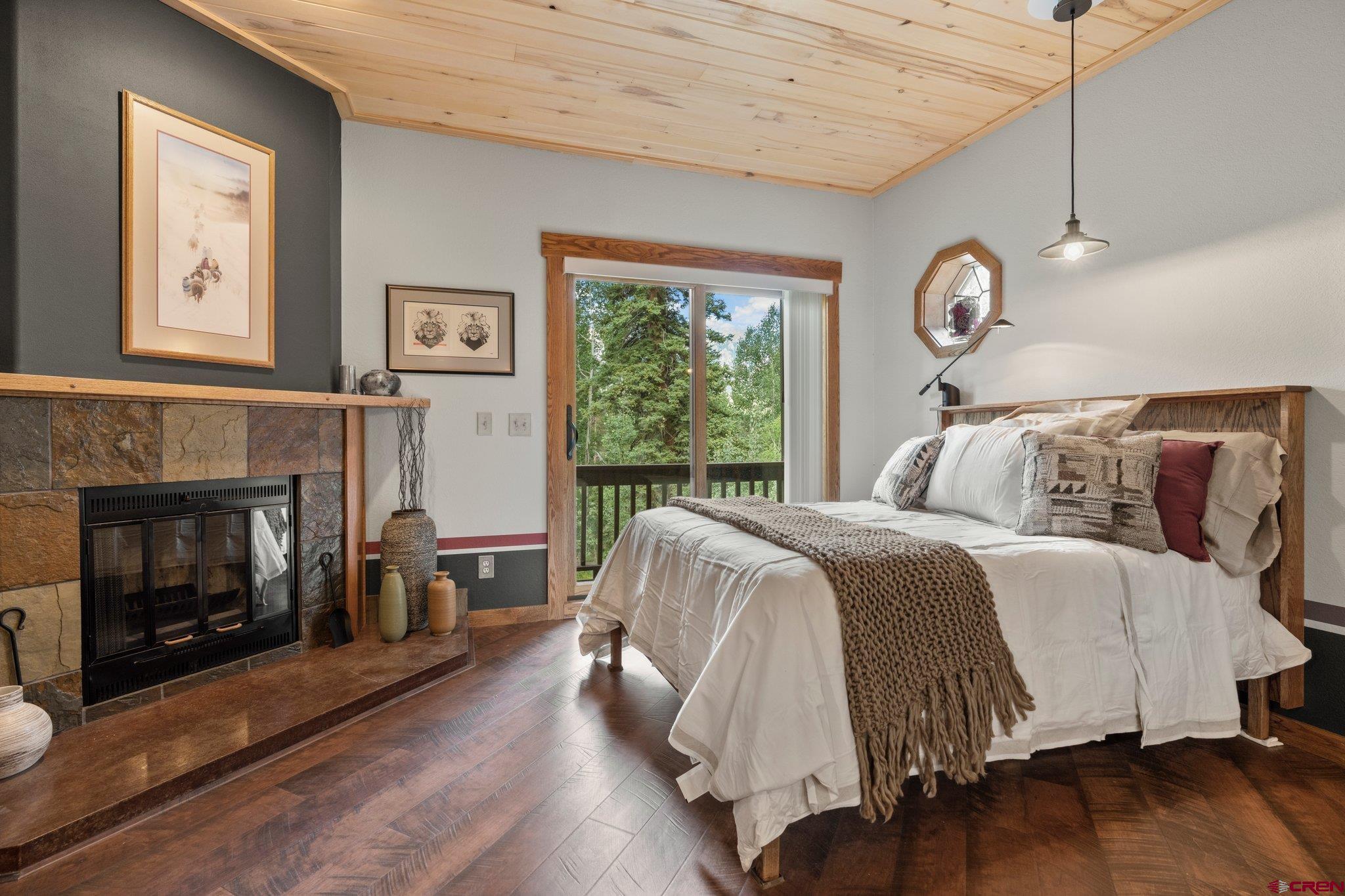 50827 Highway 550, Unit 339 Durango, CO 81301 - Photo 7 of 28 a bedroom with a bed and a fireplace