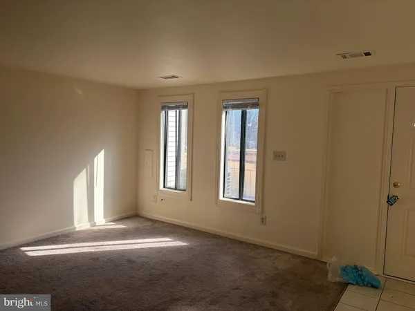 a bathroom with a toilet and a vanity