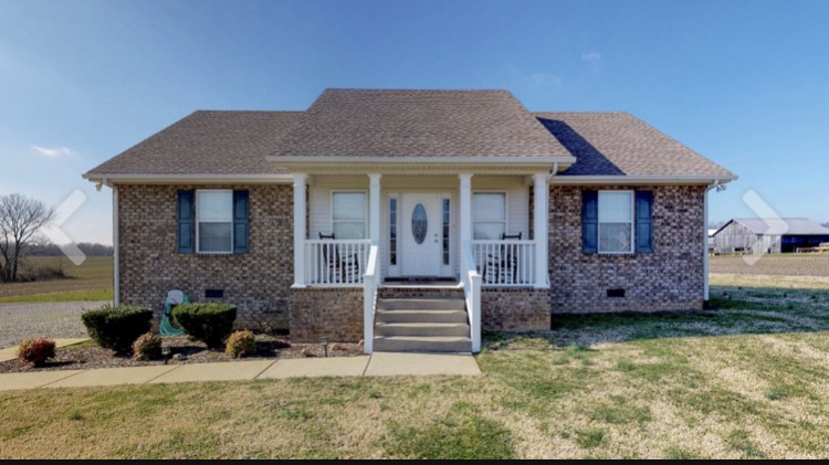 721 Lear Road Portland, TN 37148 - Photo 1 of 1 a front view of a house with garden