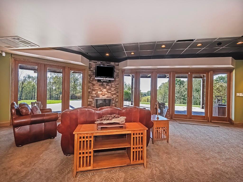 166 McKay Road Saxonburg, PA 16056 - Photo 41 of 48 a living room with furniture a flat screen tv and large windows