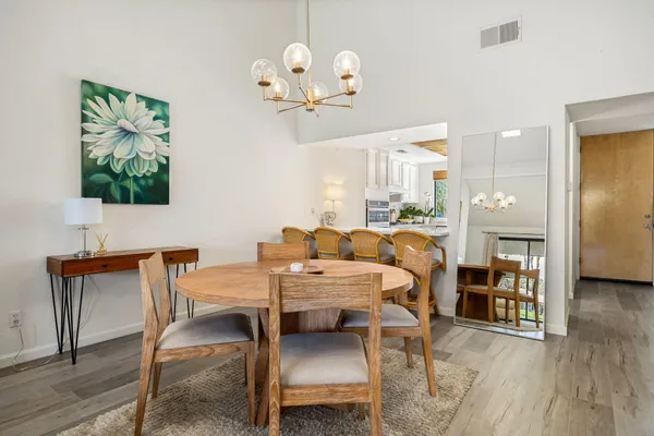 a bed room with furniture and a chandelier