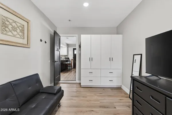 a living room with furniture and flat screen tv