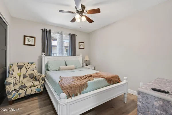 a bedroom with a bed and window