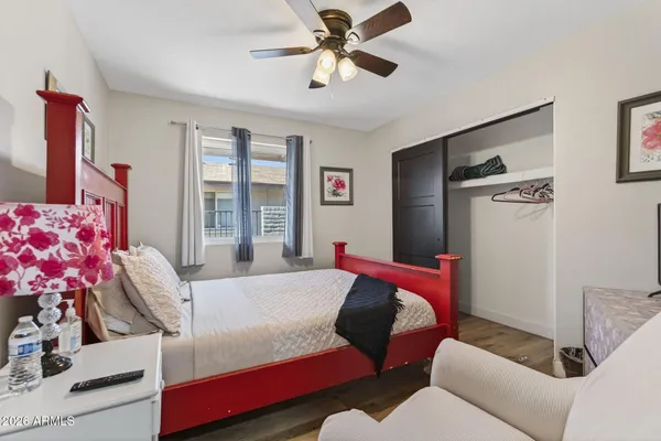 a bedroom with a bed furniture and a window