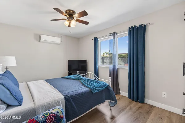 a bedroom that has a bed and a chandelier