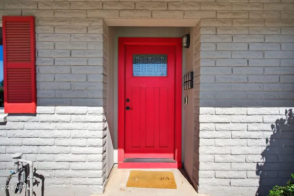 a view of front door of house with a red door