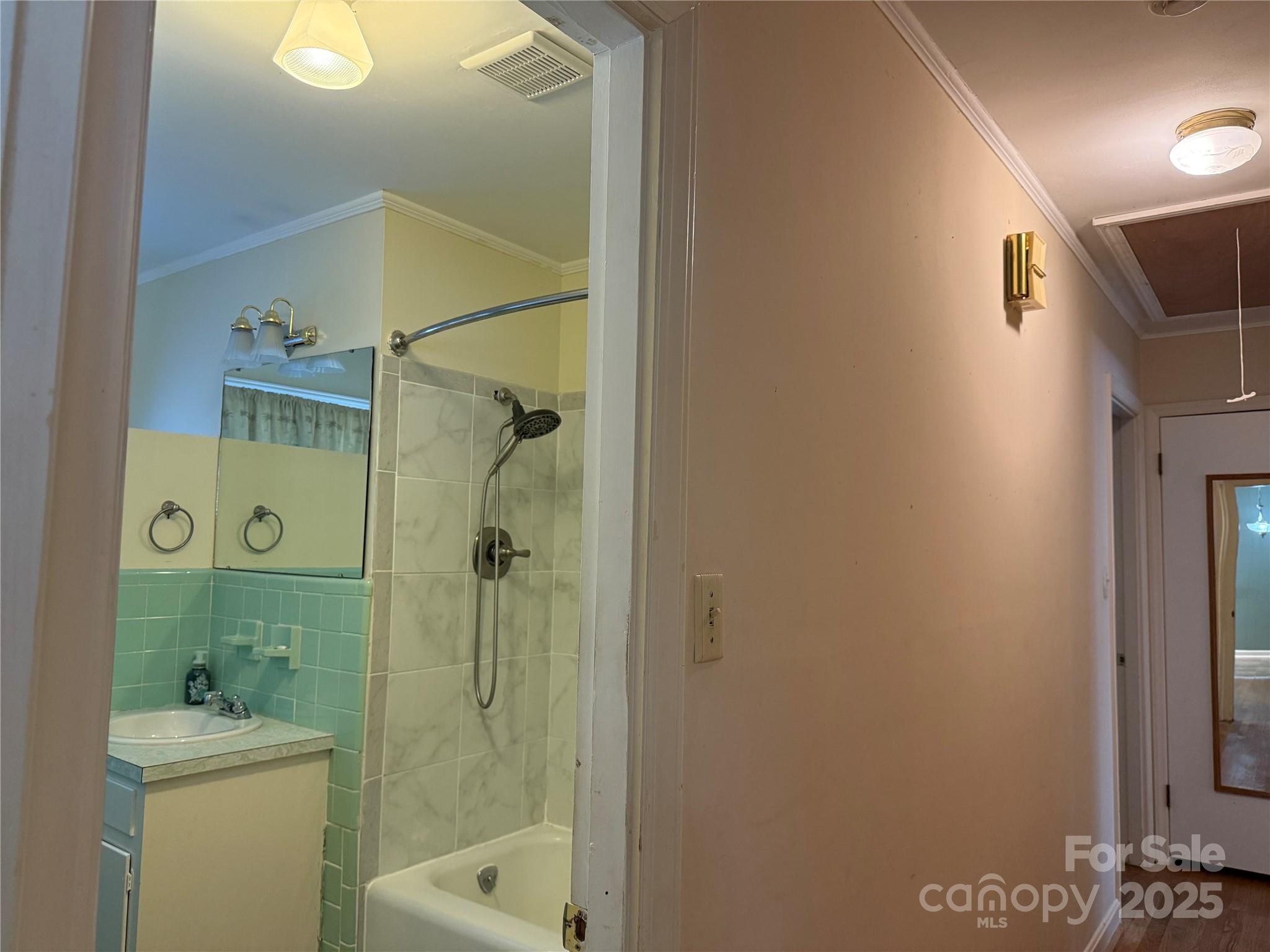 115 Chester Avenue Great Falls, SC 29055 - Photo 22 of 32 a bathroom with a shower a mirror and a toilet sink