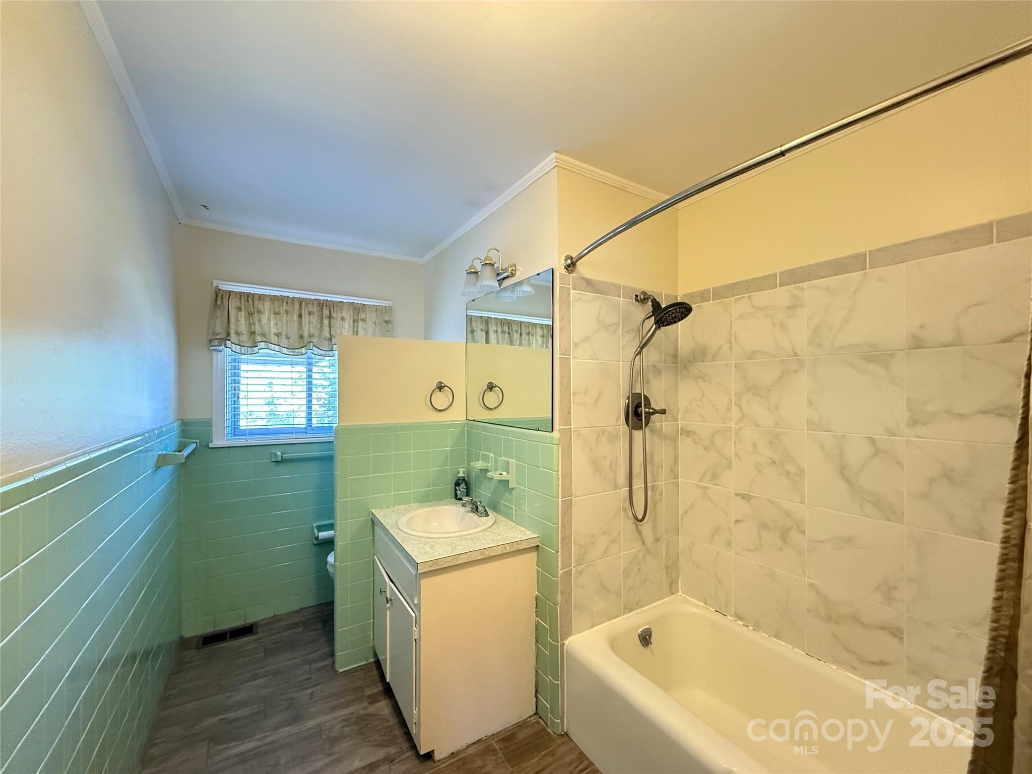 115 Chester Avenue Great Falls, SC 29055 - Photo 23 of 32 a bathroom with a sink a mirror toilet and bathtub