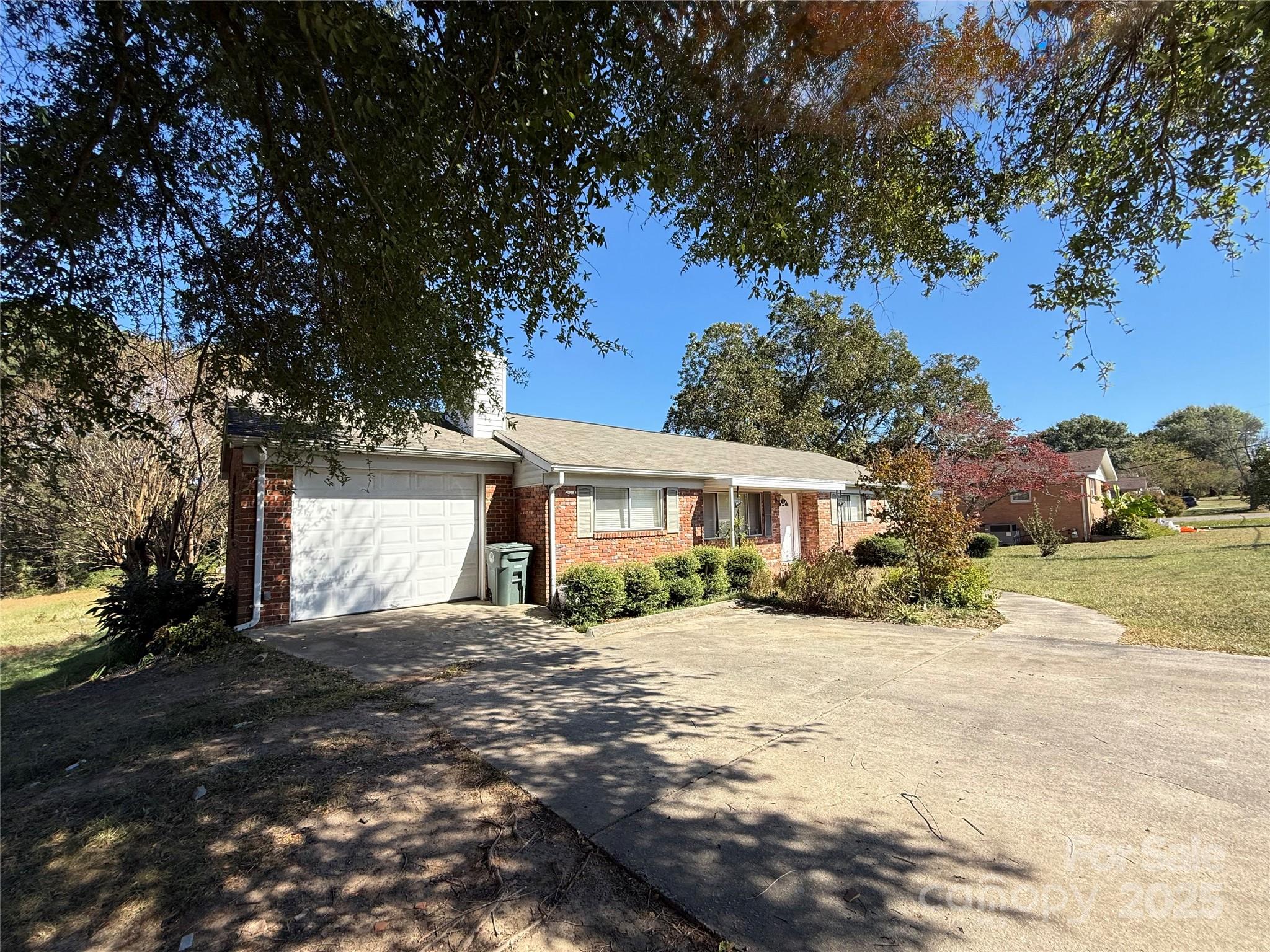 115 Chester Avenue Great Falls, SC 29055 - Photo 3 of 32 a front view of a house with a yard covered with snow