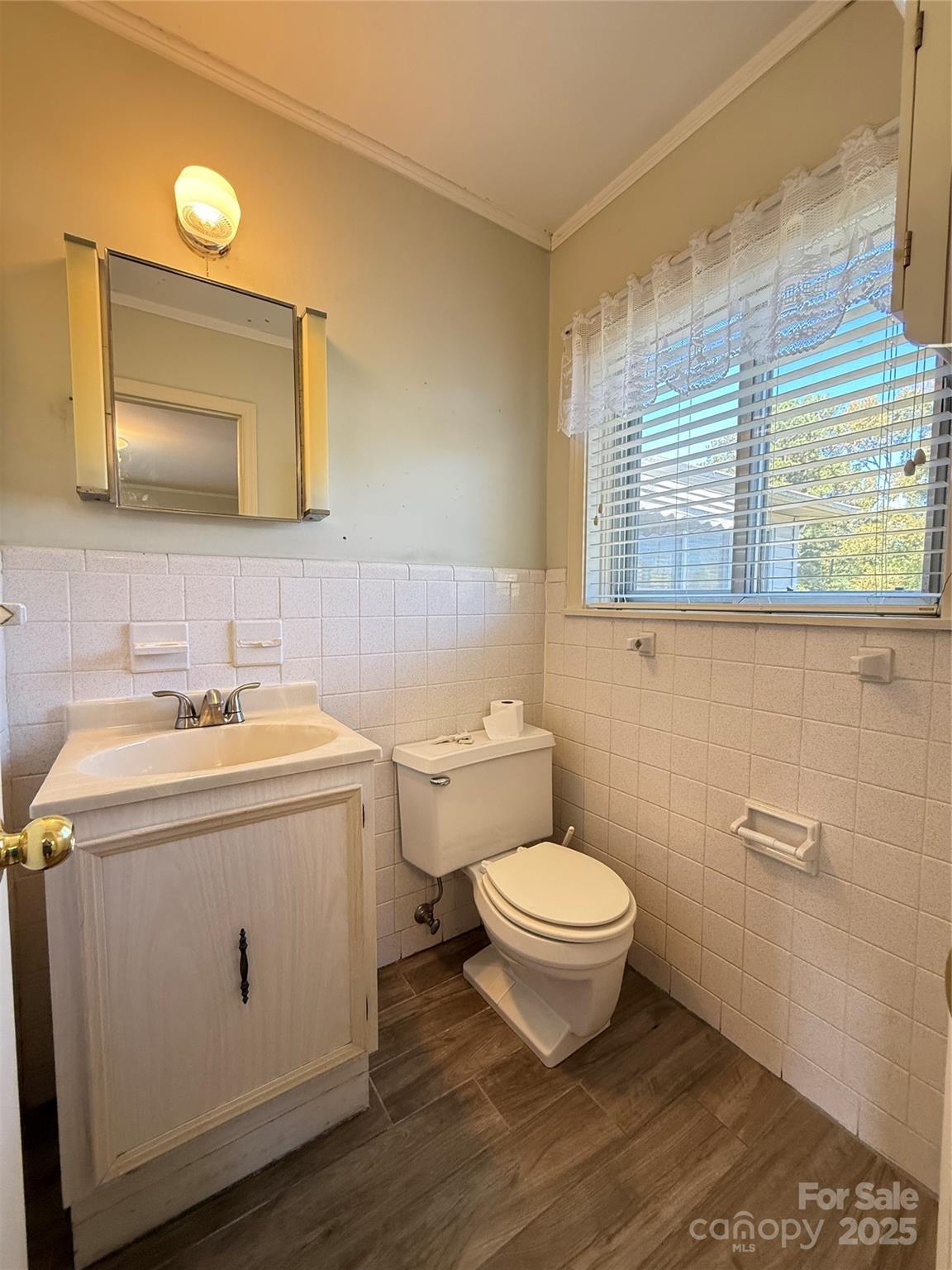 115 Chester Avenue Great Falls, SC 29055 - Photo 32 of 32 a bathroom with a toilet sink and mirror