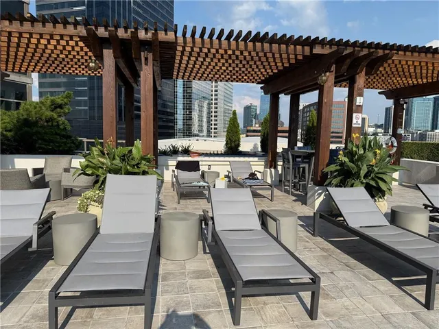 a view of a patio with table and chairs