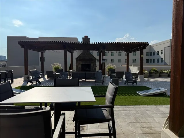 a outdoor space with patio furniture and a fireplace