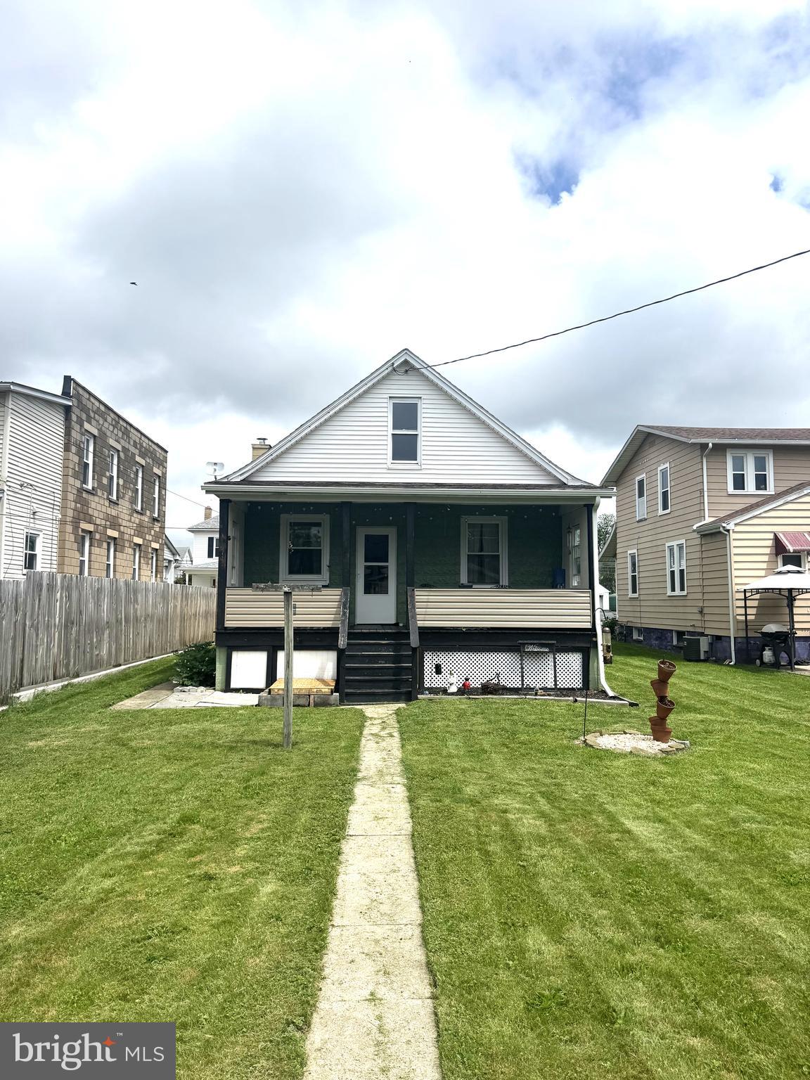 428 South Wayne Street Lewistown, PA 17044 - Photo 14 of 16 a front view of a house with a yard and trees