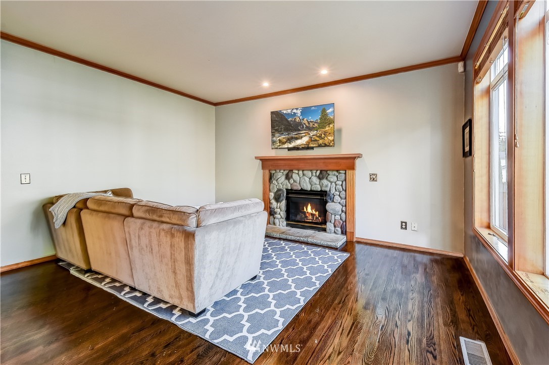3315 189th Place Southeast Bothell, WA 98012 - Photo 11 of 28 a living room with furniture and a fireplace